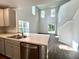 Modern kitchen featuring a stainless steel dishwasher and sink with views to the bright and open living room at 109 Rosefield Ct, Summerville, SC 29485