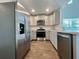 Modern kitchen with stainless steel appliances and light gray shaker cabinets at 109 Rosefield Ct, Summerville, SC 29485