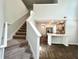 Open-concept living space with stairs, kitchen, and hardwood floors at 109 Rosefield Ct, Summerville, SC 29485