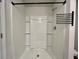 Clean white shower with sleek fixtures, including a modern shower head and towel rack at 109 Rosefield Ct, Summerville, SC 29485