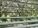 A gorgeous outdoor view featuring a lush tree, seen through white blinds on a window at 109 Rosefield Ct, Summerville, SC 29485