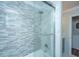 Elegant bathroom shower with mosaic tile wall, glass door and marble tile surround at 1098 Blue Marlin Dr, Charleston, SC 29412