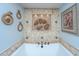 Close up of tub with fossil wall art and rope-themed wall decor at 1098 Blue Marlin Dr, Charleston, SC 29412