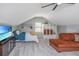 Loft bedroom with a bed, ceiling fan, tv, and orange sofa at 1098 Blue Marlin Dr, Charleston, SC 29412
