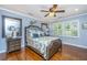 Charming bedroom with a ceiling fan, plantation shutters, and hardwood flooring at 1098 Blue Marlin Dr, Charleston, SC 29412