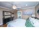 Comfortable bedroom with a ceiling fan, plantation shutters, hardwood floors, and dresser at 1098 Blue Marlin Dr, Charleston, SC 29412