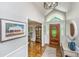 Welcoming entryway featuring a decorative rug, beautiful hardwood floors, and a wooden front door with sidelights at 1098 Blue Marlin Dr, Charleston, SC 29412