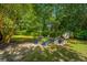 Cozy backyard fire pit area with comfortable seating, perfect for relaxing evenings under the stars at 1098 Blue Marlin Dr, Charleston, SC 29412