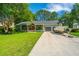 Charming single-story home with boat parking, lush lawn, and inviting front porch at 1098 Blue Marlin Dr, Charleston, SC 29412