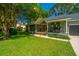 Charming single-story home with a lush front lawn and inviting front porch at 1098 Blue Marlin Dr, Charleston, SC 29412
