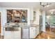 Kitchen features granite countertops, custom cabinets, stainless steel appliances, and a view to the living room at 1098 Blue Marlin Dr, Charleston, SC 29412