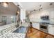 Bright kitchen with stainless steel appliances, granite counters, gas range, hardwood floors, and a center island sink at 1098 Blue Marlin Dr, Charleston, SC 29412