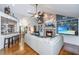 Open living room with high ceilings, a brick fireplace, hardwood floors, and a large sectional sofa at 1098 Blue Marlin Dr, Charleston, SC 29412