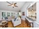 Cozy living area with hardwood floors, a ceiling fan, and views into the adjacent kitchen at 1098 Blue Marlin Dr, Charleston, SC 29412