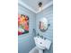 Stylish powder room with unique artwork and a modern faucet at 1098 Blue Marlin Dr, Charleston, SC 29412