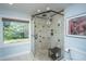 Modern bathroom shower with rainfall shower head, glass door, and tiled walls at 1098 Blue Marlin Dr, Charleston, SC 29412