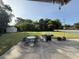 Spacious backyard with a patio, outdoor seating, grill, shed, and a lush lawn at 1139 Belvedere Dr, Hanahan, SC 29410
