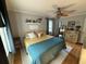 Cozy bedroom featuring warm colors, a bed with throw pillows, and a window with wooden floors at 1139 Belvedere Dr, Hanahan, SC 29410