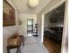 Welcoming entryway with neutral tones, a hallway and views to a kitchen and a living room at 1139 Belvedere Dr, Hanahan, SC 29410