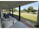 Relax on the front porch with classic rocking chairs and a view of the peaceful neighborhood street at 1139 Belvedere Dr, Hanahan, SC 29410