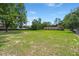 Large grassy backyard enclosed with fencing, offering ample space and privacy at 122 Lawrence Rd, Moncks Corner, SC 29461