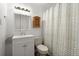 A well-lit bathroom features a vanity, medicine cabinet and patterned shower curtain at 122 Lawrence Rd, Moncks Corner, SC 29461