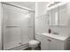 Bright bathroom featuring a glass enclosed shower, white vanity, and medicine cabinet at 122 Lawrence Rd, Moncks Corner, SC 29461