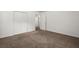 A carpeted bedroom offers closet space and entry doors at 122 Lawrence Rd, Moncks Corner, SC 29461