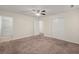 Spacious carpeted main bedroom featuring a ceiling fan, closet, and en suite at 122 Lawrence Rd, Moncks Corner, SC 29461