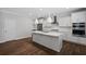 Modern kitchen features a large center island, stainless steel appliances and sleek white cabinetry at 124 Cantona Dr, Summerville, SC 29483