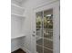 Mud room features custom shelving, a coat rack, and a door leading to the outside at 124 Cantona Dr, Summerville, SC 29483