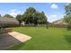 Expansive backyard featuring a play set, privacy fence, and well-maintained lawn at 136 Blue Jasmine Ln, Summerville, SC 29483