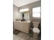 Bright bathroom with toilet, vanity and ample countertop space at 136 Blue Jasmine Ln, Summerville, SC 29483