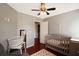 Cozy bedroom with a ceiling fan and crib, perfect for a  at 136 Blue Jasmine Ln, Summerville, SC 29483