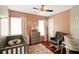 Cozy bedroom with pink walls, neutral accents, and hardwood floors at 136 Blue Jasmine Ln, Summerville, SC 29483