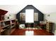 Attic bedroom with cozy seating area and hardwood floors at 136 Blue Jasmine Ln, Summerville, SC 29483