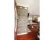 Open foyer with decorative stone accent wall, hardwood floors, and an inviting view into the living space at 136 Blue Jasmine Ln, Summerville, SC 29483