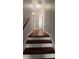 Upstairs hallway with wood floors and neutral paint at 136 Blue Jasmine Ln, Summerville, SC 29483