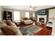 Bright living room features a fireplace, hardwood floors, and ample seating at 136 Blue Jasmine Ln, Summerville, SC 29483