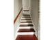 Stairway with wood steps and white risers leading upstairs at 136 Blue Jasmine Ln, Summerville, SC 29483