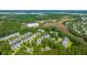 Beautiful aerial view of townhome community featuring wooded areas, ponds, and waterways at 136 Fair Sailing Rd, Mount Pleasant, SC 29466