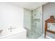 Bright bathroom featuring a soaking tub and a glass-enclosed shower with gray tile at 136 Fair Sailing Rd, Mount Pleasant, SC 29466