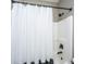 Full bathroom with shower and white shower curtain with black trim at 136 Fair Sailing Rd, Mount Pleasant, SC 29466