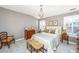 Inviting bedroom with neutral walls, chandelier, and shutters at 136 Fair Sailing Rd, Mount Pleasant, SC 29466