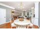 Open-concept living and dining area featuring hardwood floors and neutral paint colors at 136 Fair Sailing Rd, Mount Pleasant, SC 29466