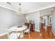 Well lit dining room featuring wood floors, elegant chandelier, and updated decor at 136 Fair Sailing Rd, Mount Pleasant, SC 29466