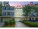 Charming townhome featuring a two-car garage, neutral colors, and manicured landscaping at 136 Fair Sailing Rd, Mount Pleasant, SC 29466