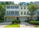 Charming townhomes featuring attached garages and landscaped front yards at 136 Fair Sailing Rd, Mount Pleasant, SC 29466