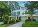 Charming townhome exterior with columns, garage, and neat landscaping at 136 Fair Sailing Rd, Mount Pleasant, SC 29466