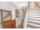 Grand foyer featuring hardwood floors, staircase, and decorative mirror at 136 Fair Sailing Rd, Mount Pleasant, SC 29466